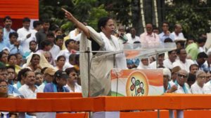 West Bengal Chief Minister Mamata Banerjee addresses supporters during a rally in Kolkata.